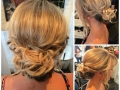 Casey gave this bridesmaid a chic messy bun with face framing fringe