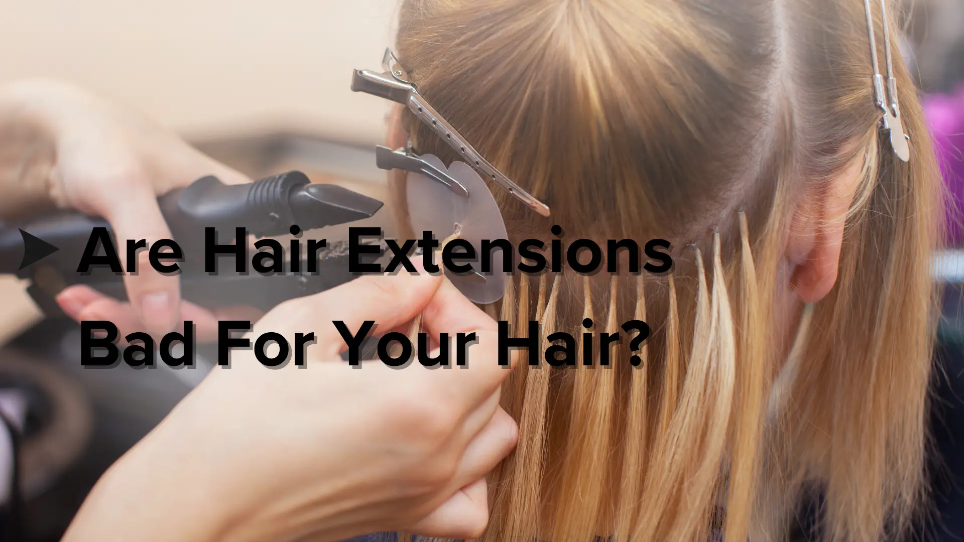 a stylist attaching hair extensions to a client's natural hair